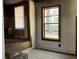 Empty living room with a view of the front yard at 8090 Colquitt St, Douglasville, GA 30134