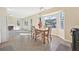 Cozy dining area with bay window and view of the fireplace at 1056 Shadow Lake Dr, Lithonia, GA 30058