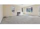 Open living room featuring a fireplace and windows that fill the room with sunlight at 1056 Shadow Lake Dr, Lithonia, GA 30058