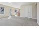 Open living room leading to dining area and featuring closet at 1056 Shadow Lake Dr, Lithonia, GA 30058