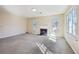 Bright living room featuring a fireplace and lots of natural light at 1056 Shadow Lake Dr, Lithonia, GA 30058