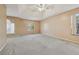 Spacious primary bedroom with trey ceiling and ample natural light at 1056 Shadow Lake Dr, Lithonia, GA 30058