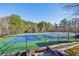 Well-maintained community tennis courts with vibrant blue and green surfaces, ready for friendly competition at 1056 Shadow Lake Dr, Lithonia, GA 30058