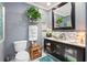 A well-appointed bathroom with stylish vanity, modern fixtures, and a decorative mirror at 1203 Cascade Park Sw Dr, Atlanta, GA 30331