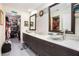 A modern bathroom featuring double sinks, sleek fixtures, and ample storage space at 1203 Cascade Park Sw Dr, Atlanta, GA 30331