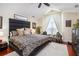 An elegant bedroom featuring a luxurious bed, plush carpet, and natural light at 1203 Cascade Park Sw Dr, Atlanta, GA 30331