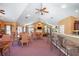 The clubhouse interior features tables, chairs, bar seating, and entertainment for community gatherings and events at 1203 Cascade Park Sw Dr, Atlanta, GA 30331