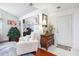 Bright entryway with white trim, hardwood floors, and stylish furnishings at 1203 Cascade Park Sw Dr, Atlanta, GA 30331