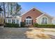 Charming brick home featuring manicured landscaping and a welcoming entrance at 1203 Cascade Park Sw Dr, Atlanta, GA 30331