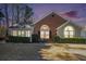Beautiful exterior view of home showcasing its architecture and landscaping at dusk at 1203 Cascade Park Sw Dr, Atlanta, GA 30331