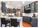 Modern kitchen featuring dark cabinets, quartz countertops, and stainless steel appliances at 1203 Cascade Park Sw Dr, Atlanta, GA 30331