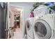 Functional laundry room with washer, dryer, and convenient access to other areas at 1203 Cascade Park Sw Dr, Atlanta, GA 30331