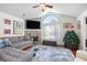 Inviting living room with a stone fireplace, large windows, and comfortable seating at 1203 Cascade Park Sw Dr, Atlanta, GA 30331