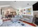 Bright living room flowing into dining, featuring hardwood floors and stylish decor at 1203 Cascade Park Sw Dr, Atlanta, GA 30331