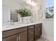 Modern bathroom featuring double sinks, neutral tones, and views to the outside at 1456 Auburn Glen Rd, Dacula, GA 30019