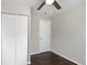 Bedroom with hardwood floors, ceiling fan, and closet with white louvered doors at 1798 Giben Rd, Atlanta, GA 30315