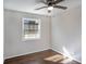 Bedroom featuring hardwood floors, a window, and a ceiling fan at 1798 Giben Rd, Atlanta, GA 30315