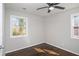 Bedroom features hardwood floors, two windows and a ceiling fan at 1798 Giben Rd, Atlanta, GA 30315