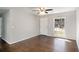 Bright living room with hardwood floors and a large window showcasing the front yard at 1798 Giben Rd, Atlanta, GA 30315