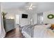 Bright bedroom features a TV mounted on the wall, offering a view of connecting rooms at 2425 Pemberton Pt, Buford, GA 30519