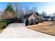 Well-maintained home with a long driveway and attached garage at 2425 Pemberton Pt, Buford, GA 30519