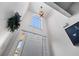 High ceiling foyer with a transom window above the door at 2425 Pemberton Pt, Buford, GA 30519