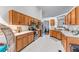 Charming kitchen nook with stainless appliances, wood cabinets and a vintage modern flair at 2425 Pemberton Pt, Buford, GA 30519