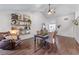 Bright living room with hardwood floors, vaulted ceiling, and decorative shelving at 2425 Pemberton Pt, Buford, GA 30519