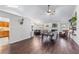 Open concept living room with hardwood floors, and a view of the kitchen at 2425 Pemberton Pt, Buford, GA 30519