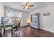 Home office with a ceiling fan, hardwood floors, and a work space by the window at 2425 Pemberton Pt, Buford, GA 30519