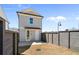 Home's backyard featuring a wooden fence, with a spacious yard offering an ideal space for outdoor enjoyment at 108 Black Gum Unit 38 Ln, Auburn, GA 30011