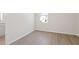 Well-lit bedroom with wood-look flooring, complemented by neutral walls and bright natural light at 108 Black Gum Unit 38 Ln, Auburn, GA 30011