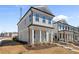 Attractive two-story home with a classic gray facade and white columns at 108 Black Gum Unit 38 Ln, Auburn, GA 30011