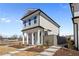 Charming two-story home with inviting front steps and landscaped yard at 108 Black Gum Unit 38 Ln, Auburn, GA 30011