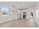 Beautiful kitchen featuring white cabinets, stainless steel appliances, and a modern chandelier at 108 Black Gum Unit 38 Ln, Auburn, GA 30011