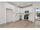Stylish kitchen with white cabinetry, stainless steel appliances, and elegant marble backsplash at 108 Black Gum Unit 38 Ln, Auburn, GA 30011