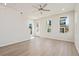 Bright living room boasts ample natural light, light wood flooring, and access to the outdoors at 108 Black Gum Unit 38 Ln, Auburn, GA 30011