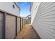 A narrow side yard features a wood fence and low maintenance ground cover at 108 Black Gum Unit 38 Ln, Auburn, GA 30011