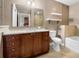 Bathroom featuring vanity with granite counters, toilet, and tiled shower/tub combo at 201 W Ponce De Leon Ave # 315, Decatur, GA 30030