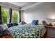 Cozy bedroom with abundant natural light from the large windows at 201 W Ponce De Leon Ave # 315, Decatur, GA 30030