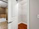 Walk-in closet with white wire shelving and hardwood floors at 201 W Ponce De Leon Ave # 315, Decatur, GA 30030