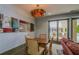 Cozy dining area with unique lighting fixture and access to outdoor pool at 201 W Ponce De Leon Ave # 315, Decatur, GA 30030