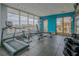 Well-equipped gym featuring modern exercise machines and weights near a bright window overlooking the outdoors at 201 W Ponce De Leon Ave # 315, Decatur, GA 30030