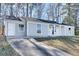 Charming, single-story home featuring a welcoming entrance, light-blue siding and a well-manicured lawn at 2216 Marbut Farms Trce, Lithonia, GA 30058