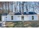 Charming, single-story home featuring a welcoming entrance, light-blue siding and a well-manicured lawn at 2216 Marbut Farms Trce, Lithonia, GA 30058