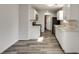 Modern kitchen features white cabinetry, stainless steel appliances, and stylish backsplash at 2216 Marbut Farms Trce, Lithonia, GA 30058