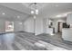 Bright living room boasts an open layout, new floors, and modern vaulted ceilings at 2216 Marbut Farms Trce, Lithonia, GA 30058