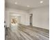 Spacious living room showcasing vaulted ceilings, light gray wood floors and natural light at 2216 Marbut Farms Trce, Lithonia, GA 30058