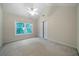 Well-lit bedroom with a window, closet, and neutral tones, creating a comfortable and serene space at 5960 Camelia Dr, Douglasville, GA 30135