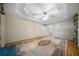 Expansive main bedroom with a tray ceiling, chandelier, hardwood floors and separate doorways at 5960 Camelia Dr, Douglasville, GA 30135